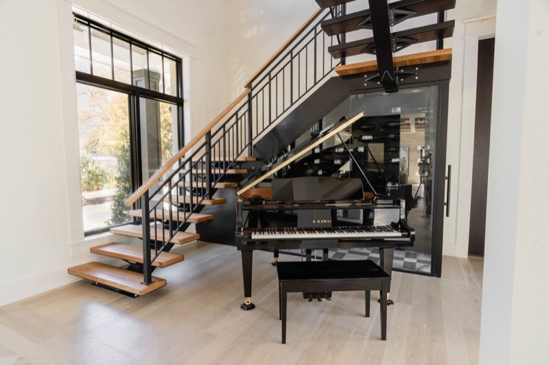 Stair, piano and the wine room beneath