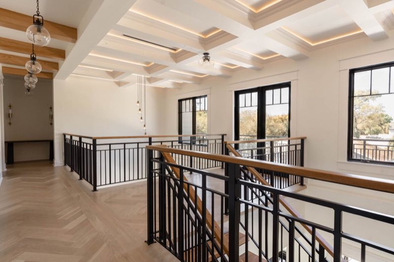 Second-floor landing under coffered ceilings