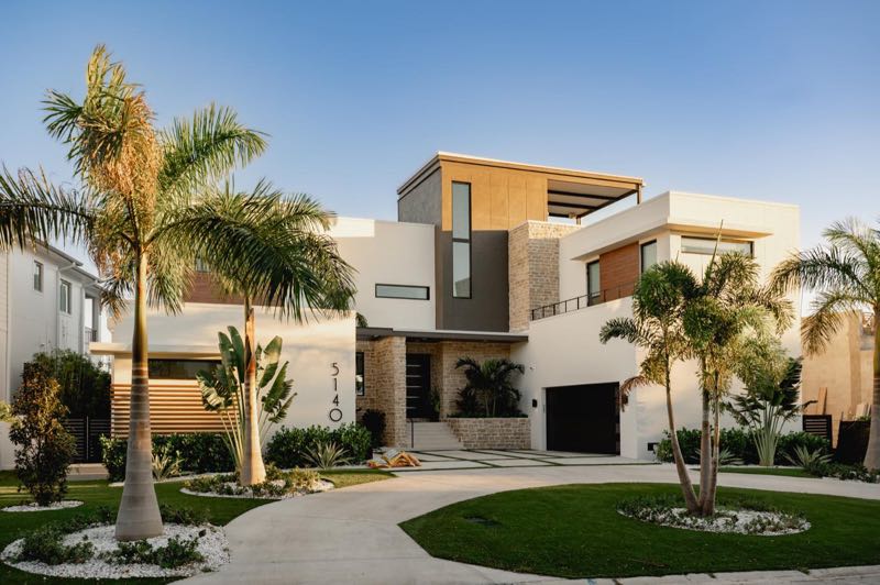 Front elevation of the San Jose House with palms