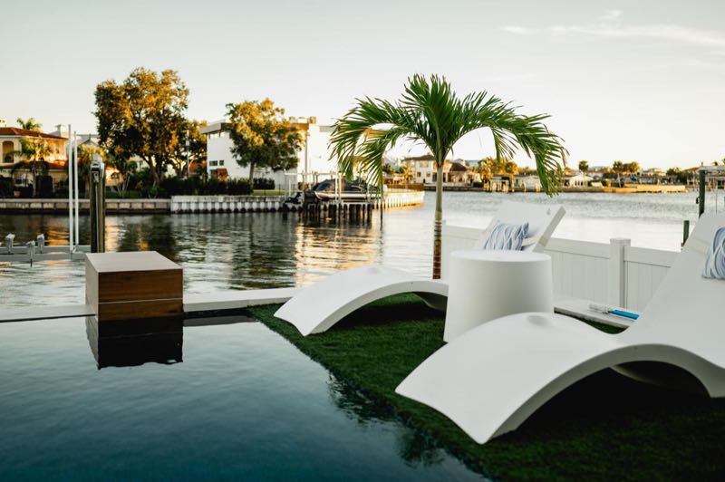 Pool and loungers looking out over the bay