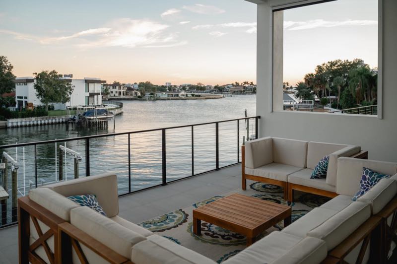 Upper balcony over the water at sunset