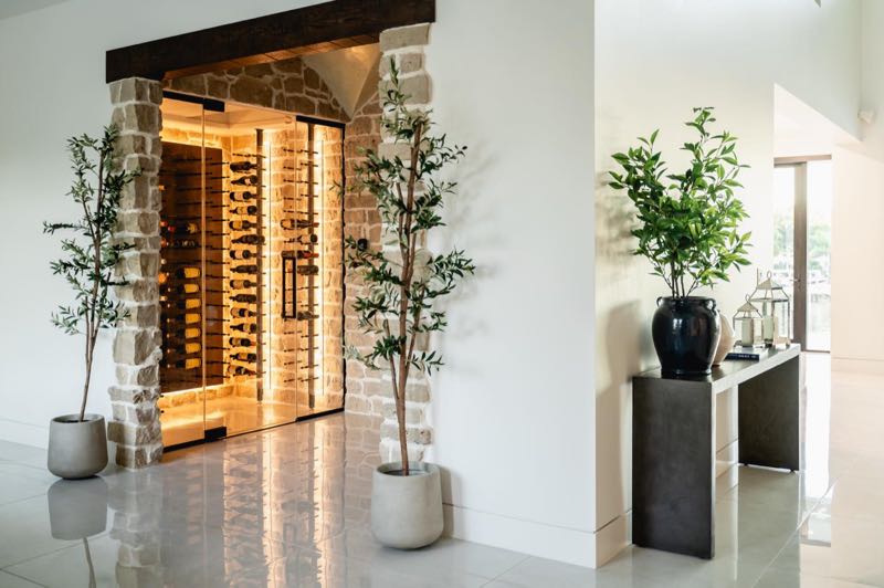 Glass-fronted wine room off the hall