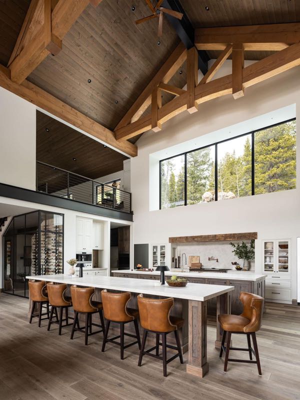 Chef’s kitchen with double islands under timber trusses