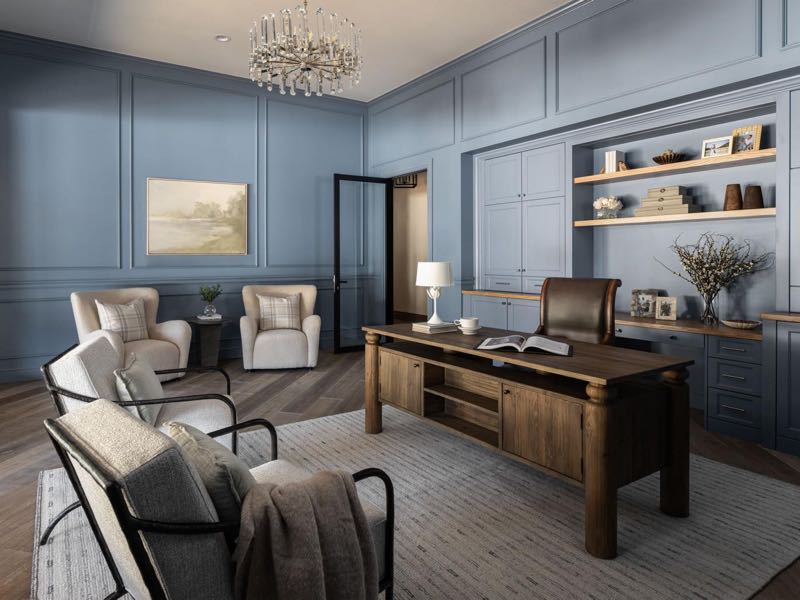 Blue-panelled office with a wood desk