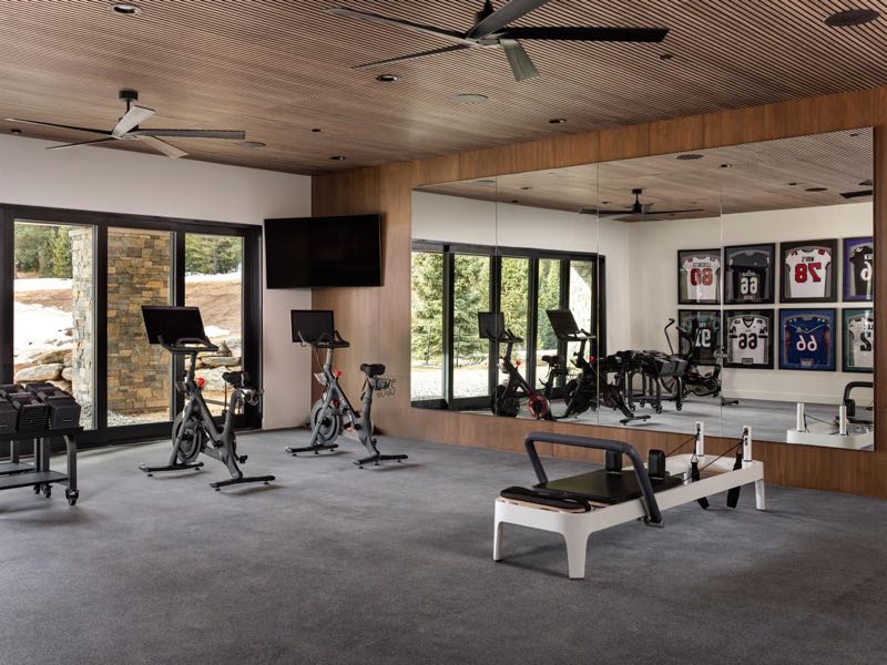 Full gym with a wood ceiling and mountain views